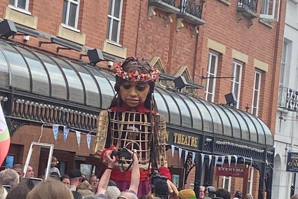 Refugee Day march with giant puppet