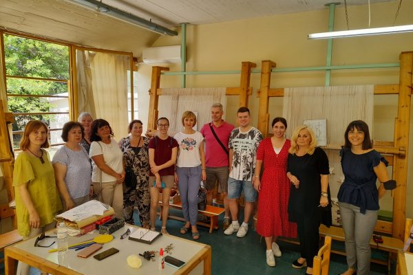 Staff visiting the weaving department