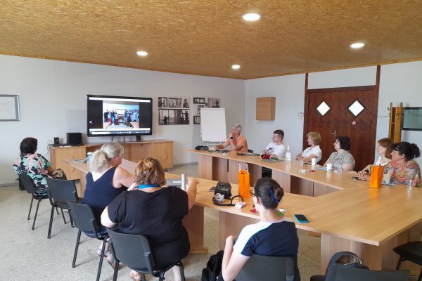 Staff listen to a project presentation